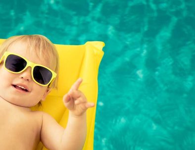 funny-baby-boy-in-swimming-pool-QT8PA3E